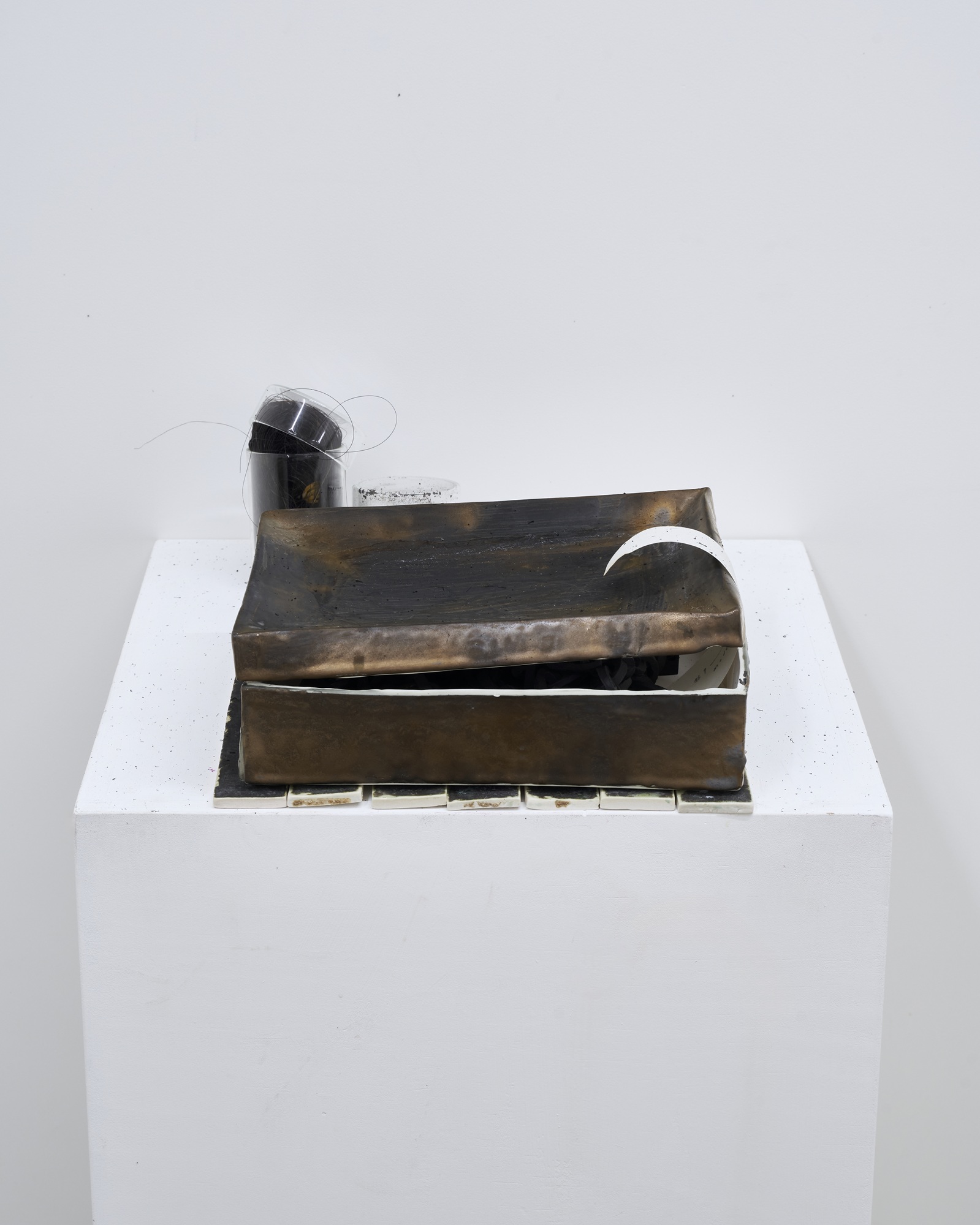 #14, 2026, glazed black clay, black horse hair, black salt, glass, sound, 26 x 29.5 x 9.5 cm 