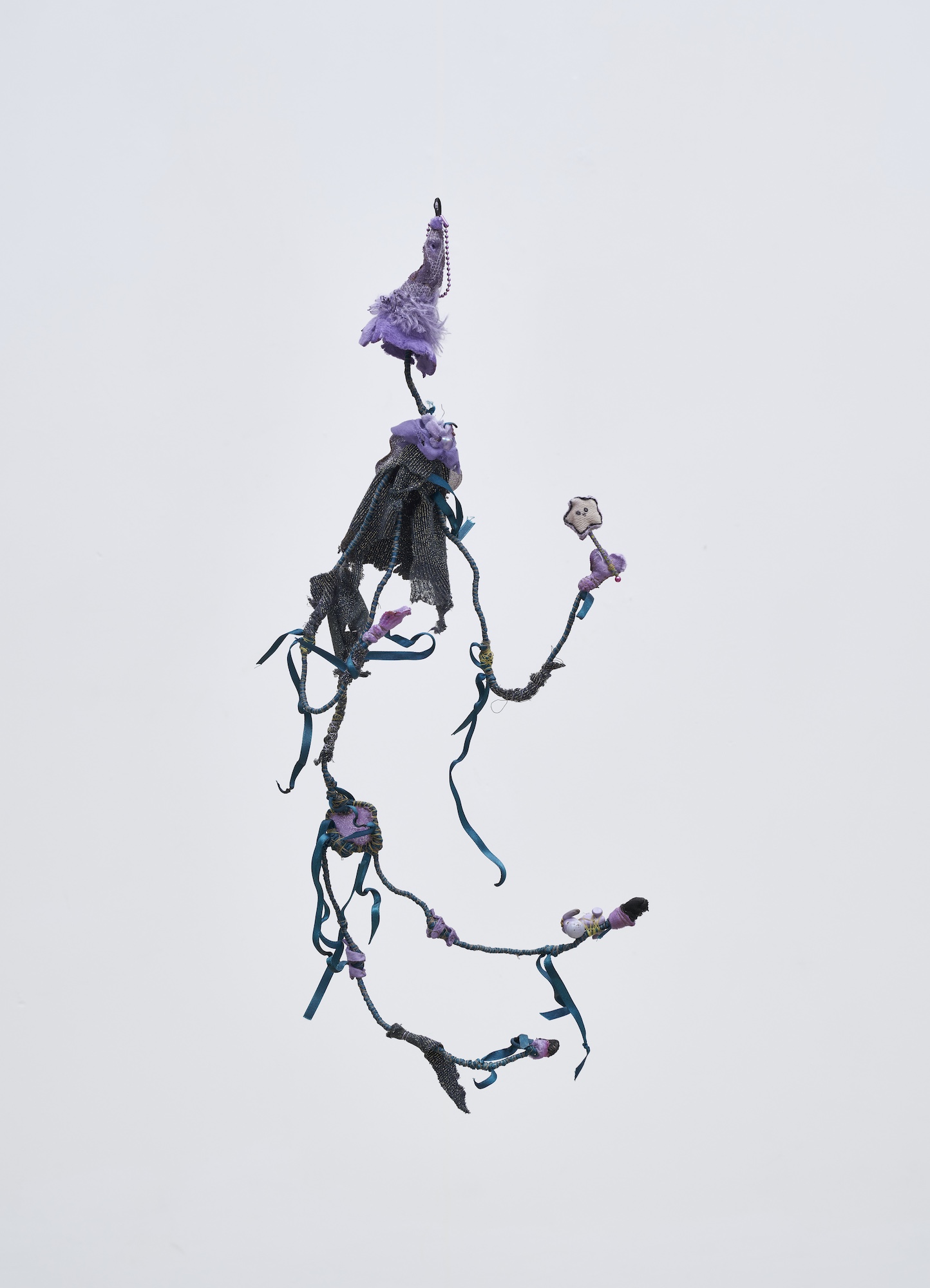 Flower 27, 2026, Wire, cord, thread, pigment, fabric, found objects, dolls, miniatures, 15.5x65.5x16cm
