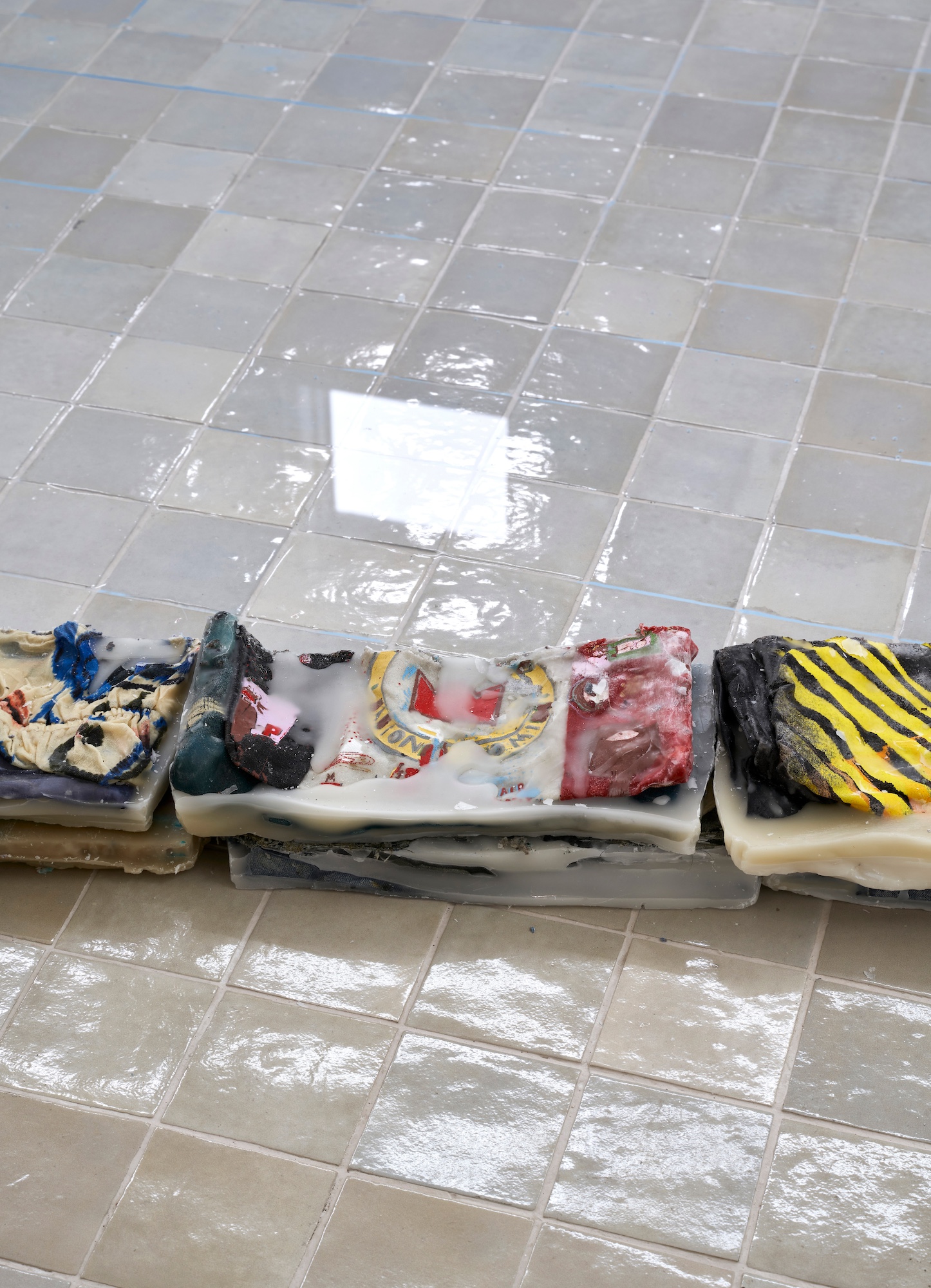 Bathtub(Detail), 2026, Clothing, beeswax, paraffin (partially reused from Clothes (2010)), polyethylene sheeting, water, Dimensions variable