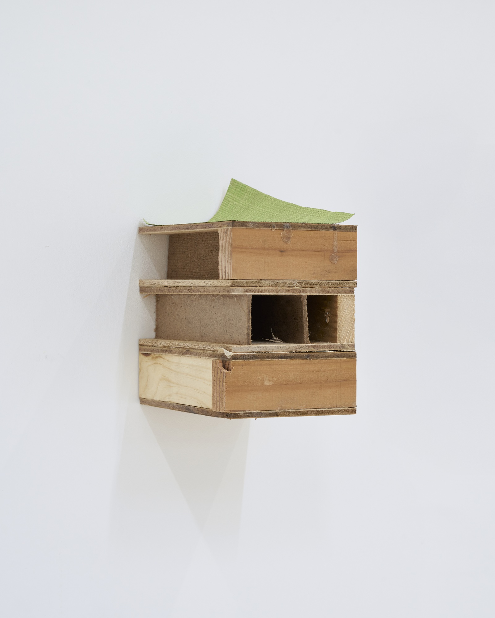 Th&eacute;o Combaluzier, (in another room?), 2025, plywood, hardboard (Isorel), wood, neoprene glue, wallpaper, tape, calendar photo, audio device, 10x15x13.5cm